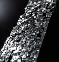 Square Steel Bars – High-Quality Steel for Various Industries (Grades: 1040, 1045, 1030, 1050, S235JR, S355JR) Stacked square steel bars available in grades 1040, 1045, 1030, 1050, S235JR, S355JR, stored for industrial and export purposes.